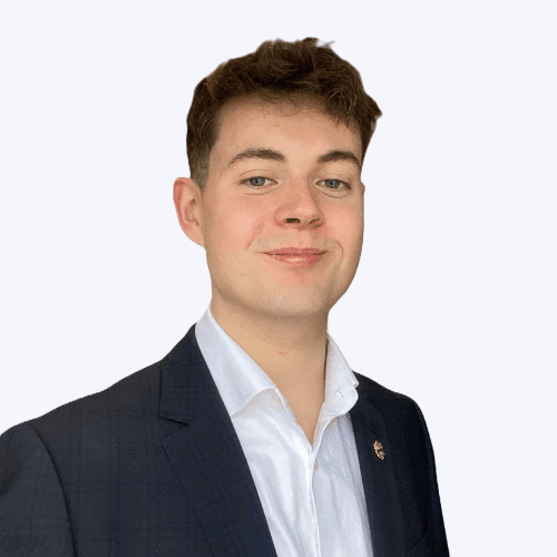 A portrait photo against a plain background of Sam McCallister