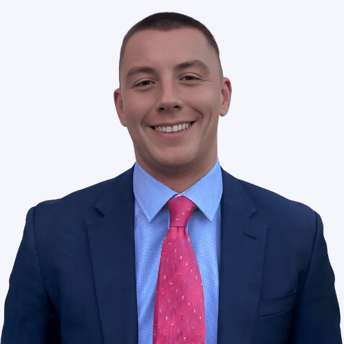 A portrait photo against a plain background of Tom Risby